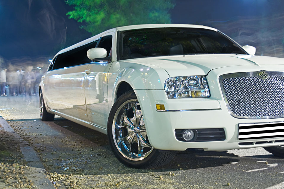 A well kept limousine ready for departure to a ball in the city