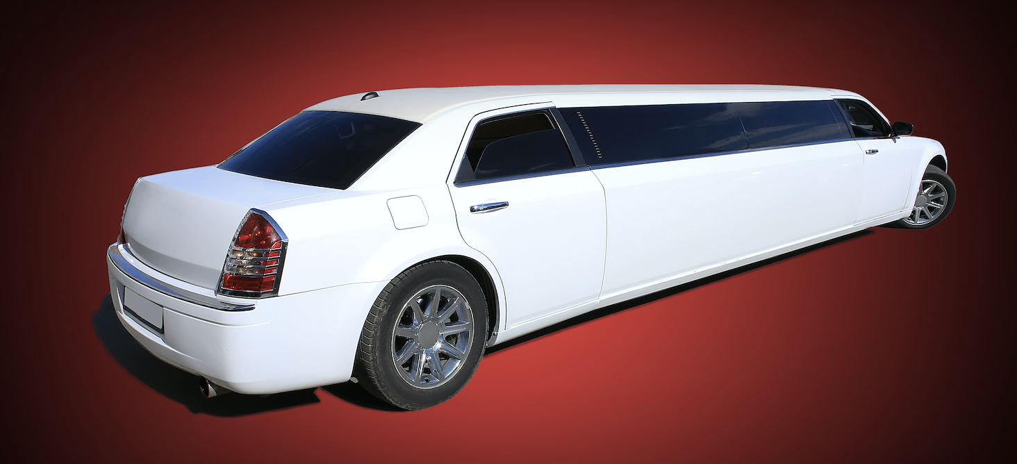 A white Chrysler Limo on a red backdrop.